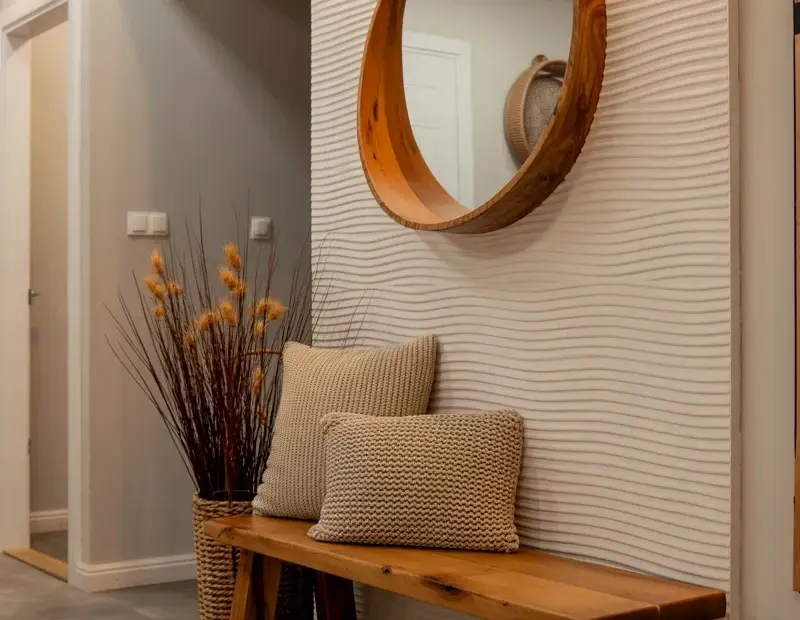 Budget-friendly rustic entryway decor with textured wall panel and wooden mirror