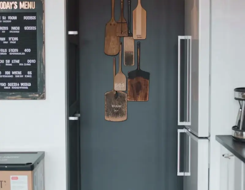 Dark gray hallway accent wall ideas with vintage menu board and modern storage